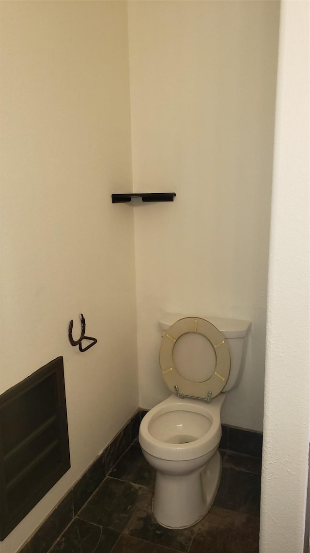 bathroom with tile patterned flooring and toilet