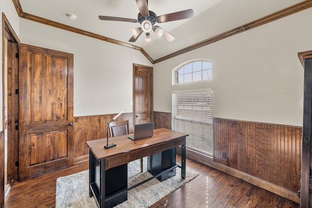 office space with lofted ceiling, a wainscoted wall, and wood walls