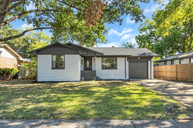 single story home with a front lawn and a garage