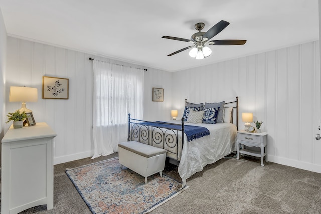 bedroom with ceiling fan and dark carpet