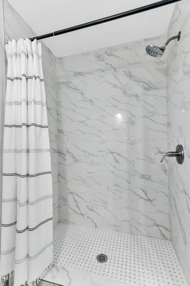 bathroom with a shower with shower curtain