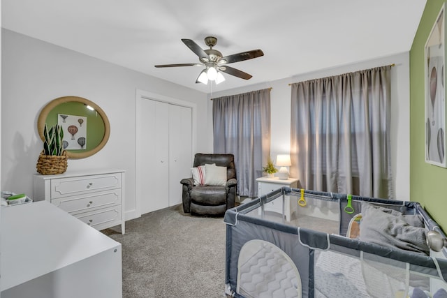 carpeted bedroom with ceiling fan and a closet