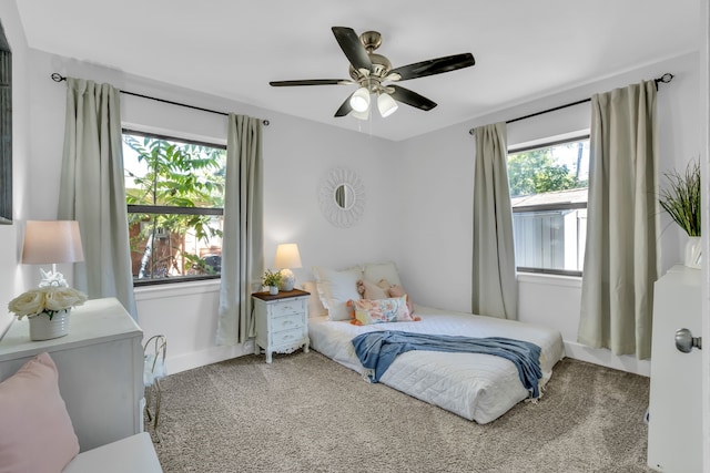 carpeted bedroom featuring ceiling fan