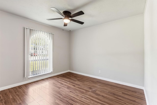 spare room featuring dark hardwood / wood-style floors and ceiling fan