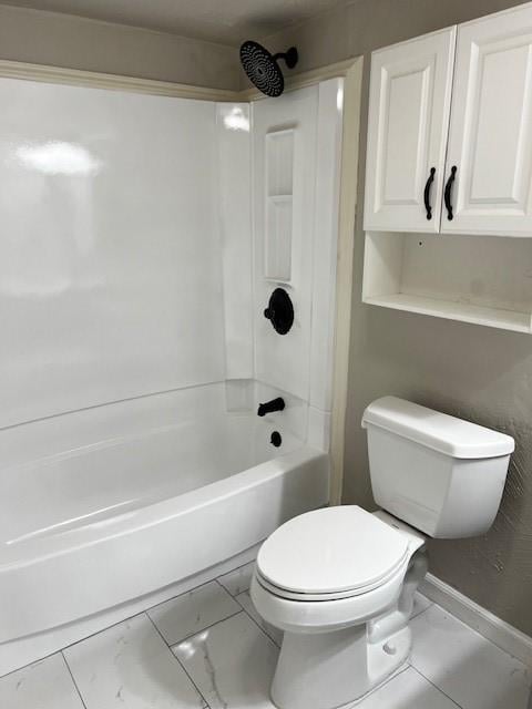 bathroom featuring shower / bathtub combination and toilet