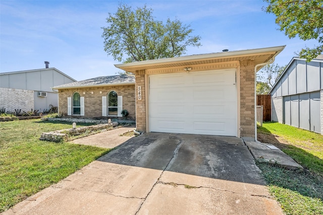 ranch-style house featuring a front yard and a garage