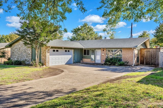 ranch-style house with a garage and a front lawn