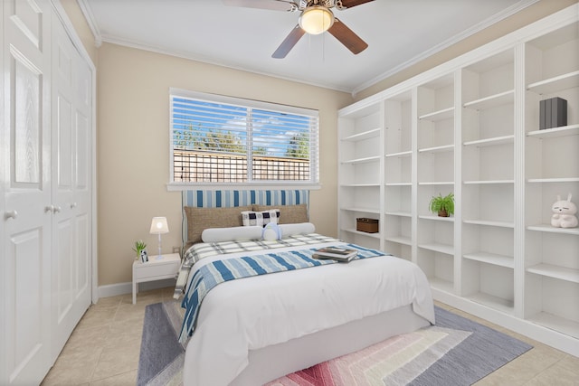 tiled bedroom featuring a closet, ceiling fan, and ornamental molding