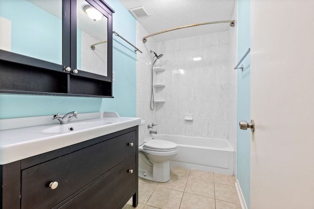 full bathroom with tile patterned floors, a textured ceiling, toilet, vanity, and tiled shower / bath