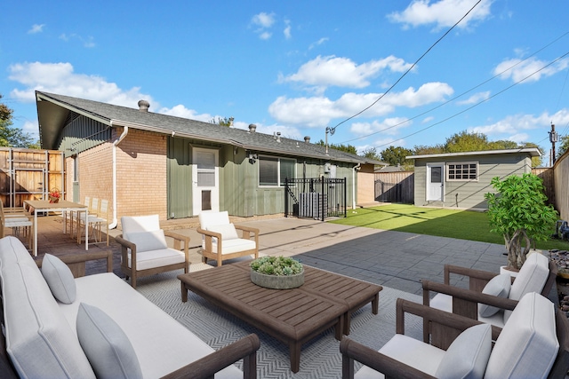 view of patio / terrace with outdoor lounge area and an outdoor structure