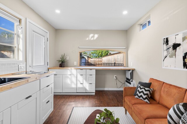 kitchen with white cabinets and dark hardwood / wood-style floors