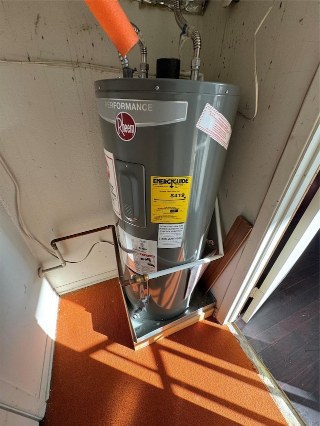 utility room with water heater