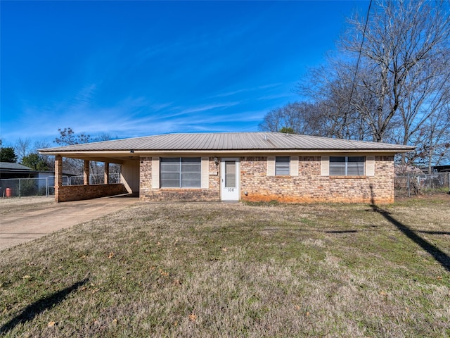 ranch-style home with a front yard and a carport