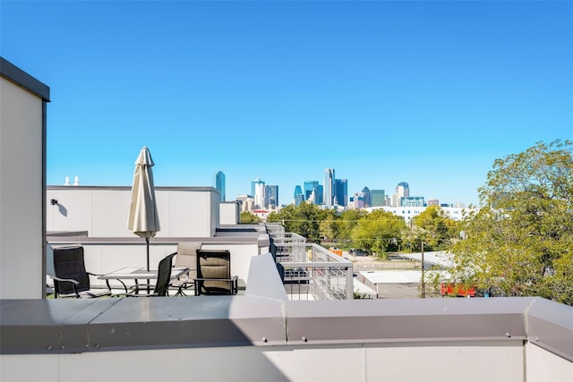 view of patio featuring a balcony