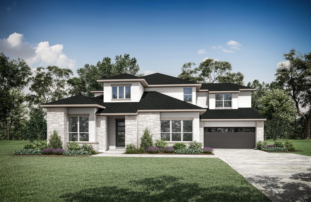 prairie-style home featuring a front yard and a garage