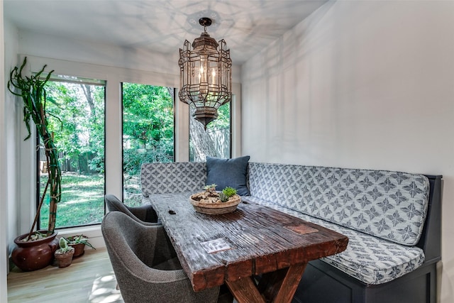 dining room with a chandelier and wood-type flooring