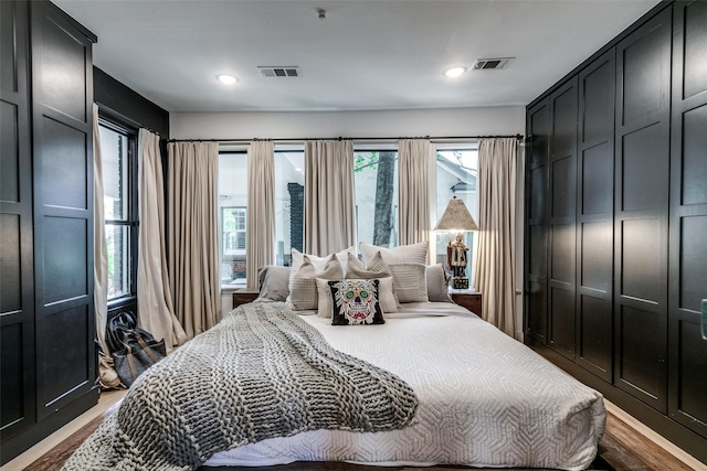 bedroom with hardwood / wood-style floors