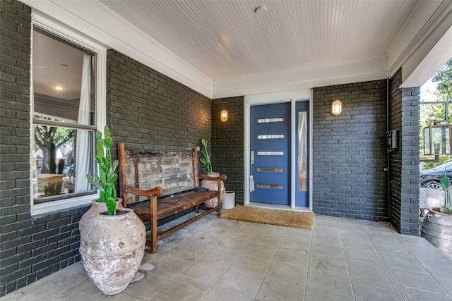 doorway to property with covered porch