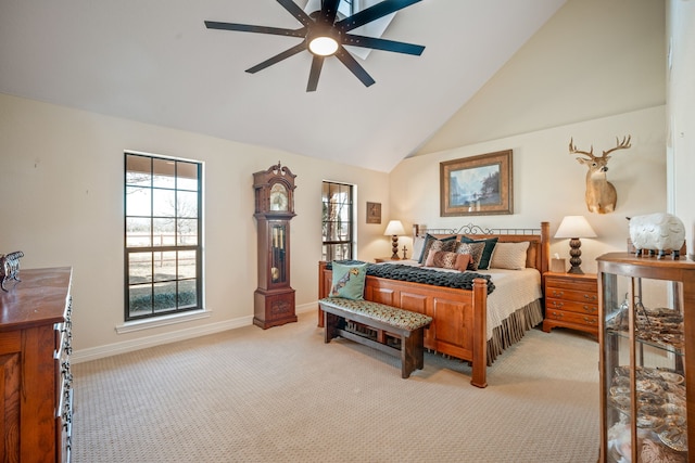 carpeted bedroom with high vaulted ceiling and ceiling fan