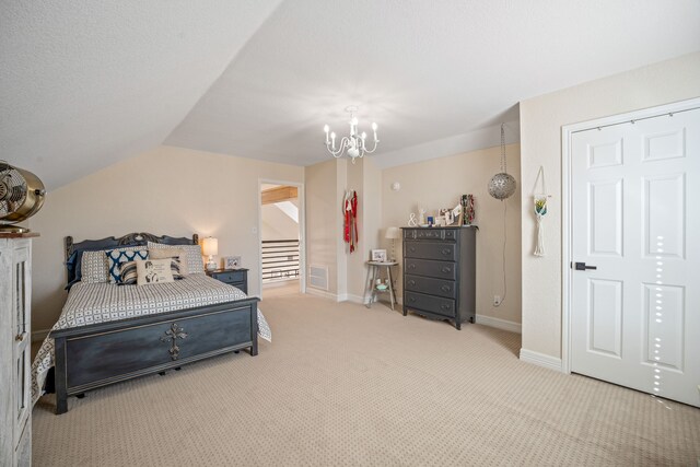 bedroom featuring light colored carpet, vaulted ceiling, and a notable chandelier