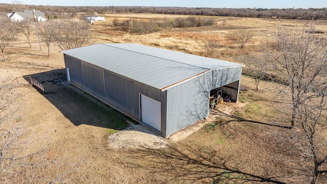 view of outdoor structure featuring a rural view