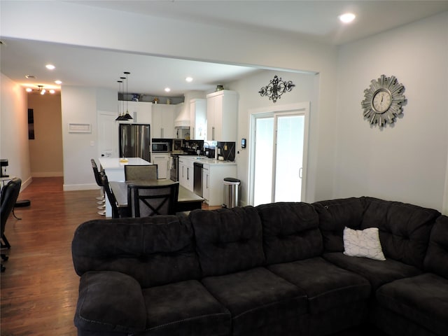 living room featuring dark hardwood / wood-style flooring