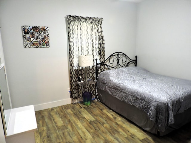 bedroom featuring hardwood / wood-style floors