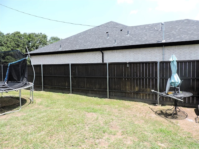 view of yard featuring a trampoline