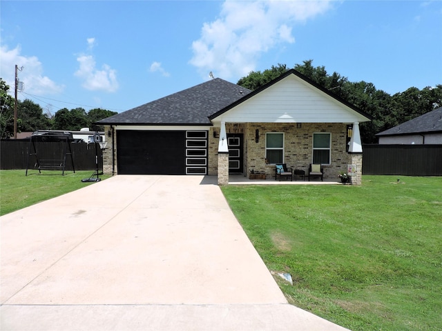 view of front facade featuring a porch, a garage, and a front yard