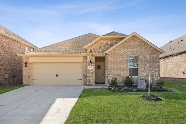 view of front of property with a garage and a front lawn