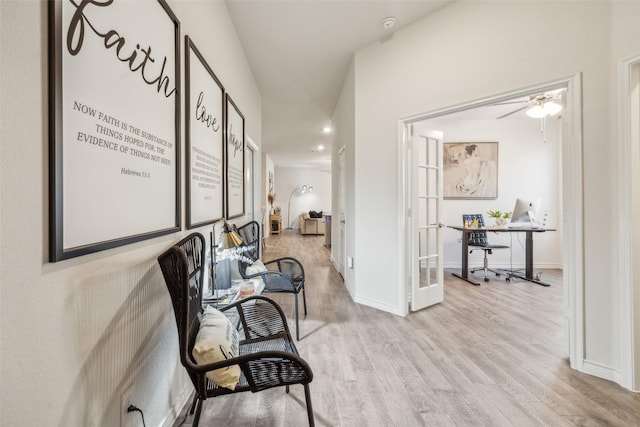 corridor featuring french doors and light hardwood / wood-style floors