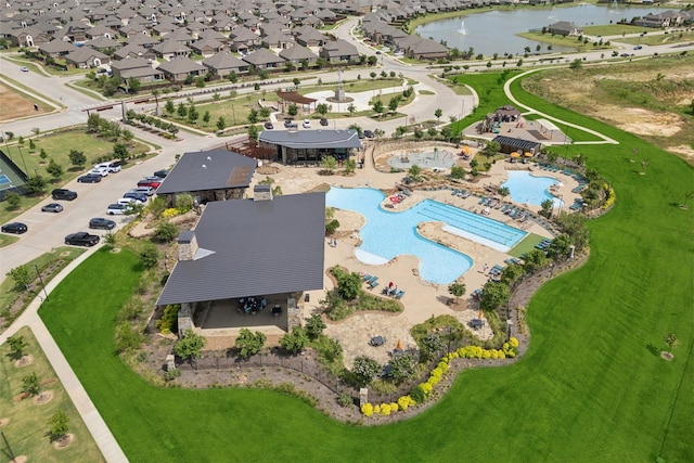 birds eye view of property featuring a water view