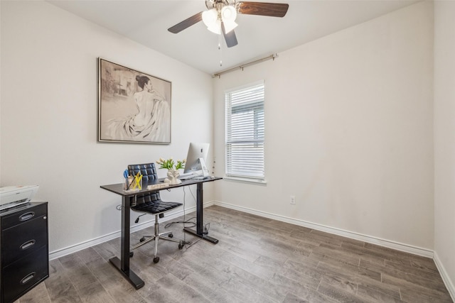 office with ceiling fan and hardwood / wood-style flooring