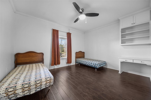 bedroom featuring ceiling fan, crown molding, and dark hardwood / wood-style floors