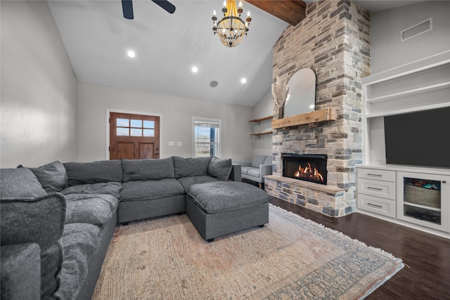 living room with ceiling fan with notable chandelier, beam ceiling, hardwood / wood-style flooring, high vaulted ceiling, and a fireplace