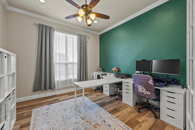 home office featuring hardwood / wood-style floors, ceiling fan, and crown molding