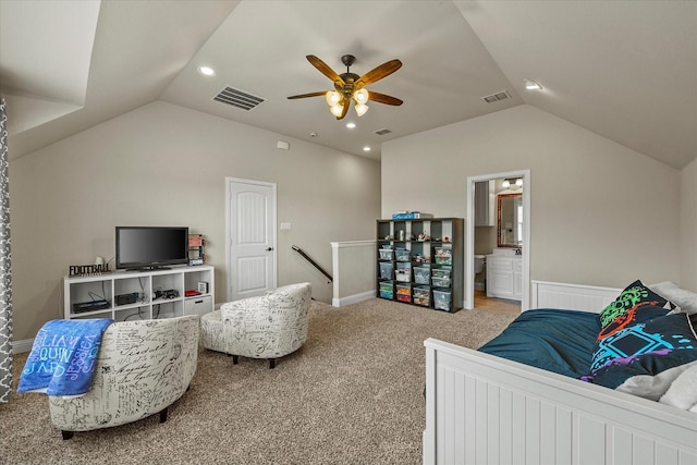 carpeted bedroom featuring ensuite bath, ceiling fan, and vaulted ceiling