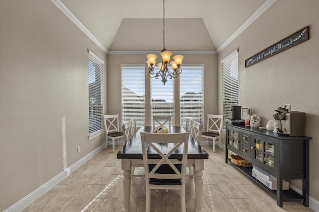 dining room with a chandelier, lofted ceiling, and ornamental molding