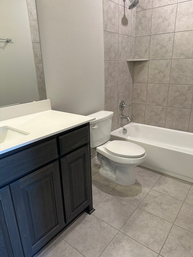 full bath with toilet, tile patterned floors, washtub / shower combination, and vanity