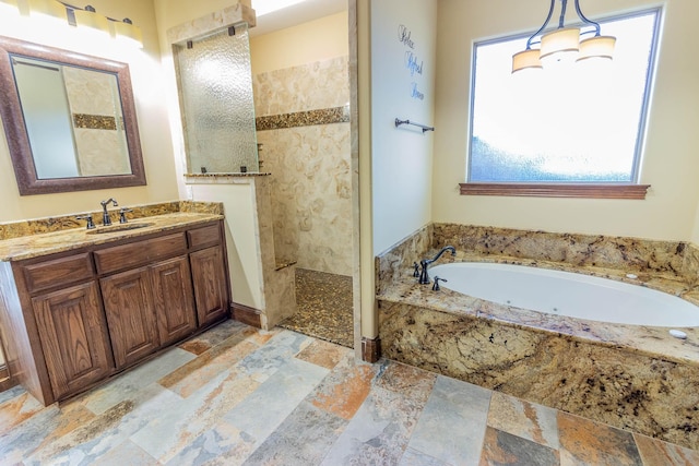 full bathroom featuring a wealth of natural light, a garden tub, stone tile floors, and a walk in shower