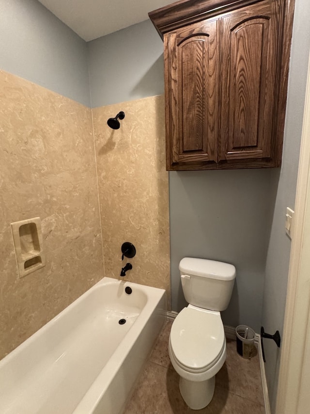 bathroom featuring tile patterned floors, shower / washtub combination, and toilet