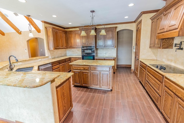 kitchen featuring arched walkways, light stone counters, a peninsula, black appliances, and a sink