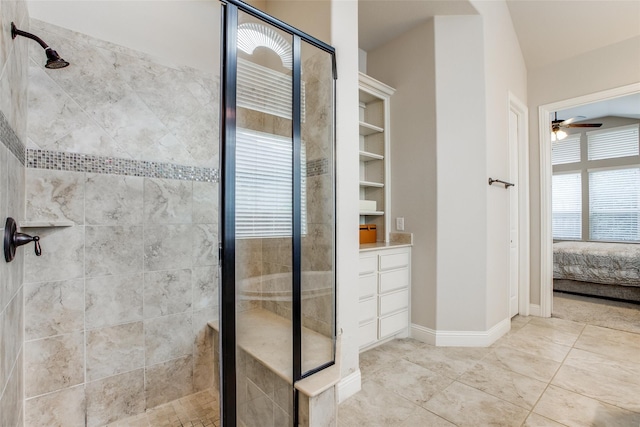 bathroom with ceiling fan and an enclosed shower