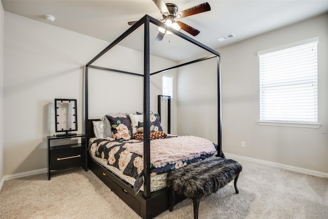 carpeted bedroom featuring ceiling fan