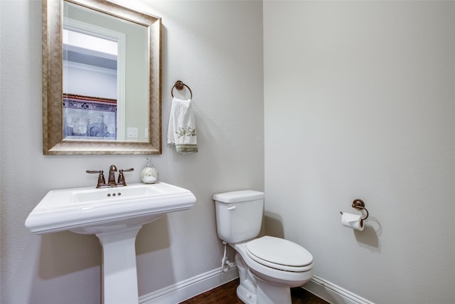 bathroom with toilet and sink