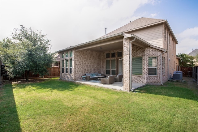 back of property with an outdoor living space, central AC unit, a patio area, and a lawn