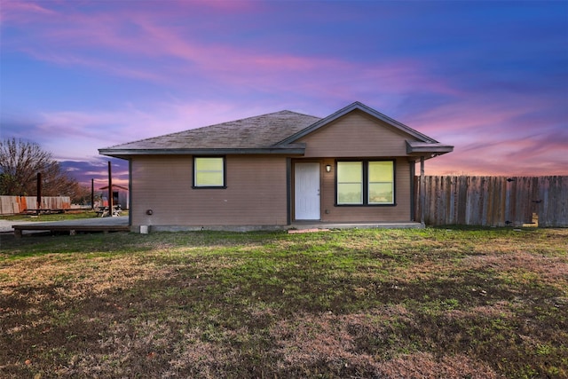 view of front of home with a yard