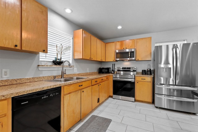 kitchen featuring sink, light tile patterned floors, and appliances with stainless steel finishes