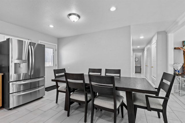 dining room featuring a textured ceiling