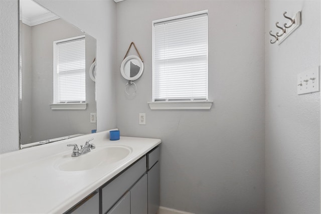 bathroom with vanity and crown molding